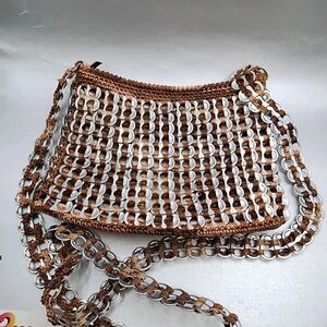 handmade shoulder bag crafted from recycled aluminum soda pop tabs crocheted